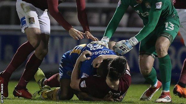 Shrewsbury's Abu Ogogo (on top) and Northampton's John-Joe O'Toole were both sent off following their 65th-minute confrontation at Sixfields