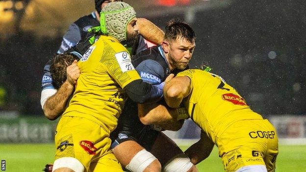 Glasgow Warriors' Ryan Wilson is held up against La Rochelle