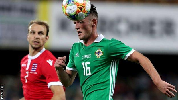 Lars Krogh Gerson and Jordan Thompson vie for the ball during NI's win over Luxembourg