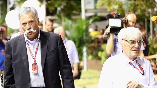 Chase Carey (left) and Bernie Ecclestone