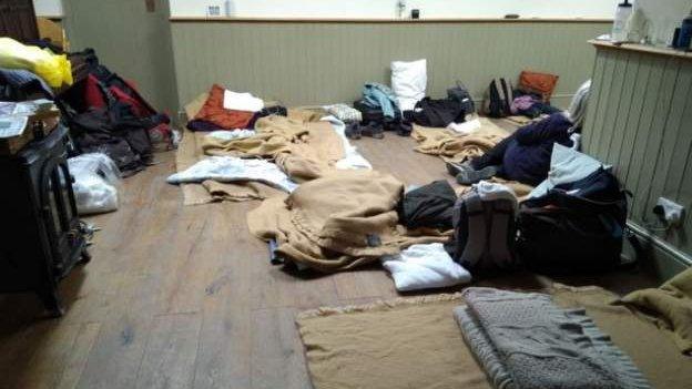 Blankets on floor of pub