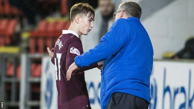 Hearts manager Craig Levein consoles midfielder Harry Cochrane