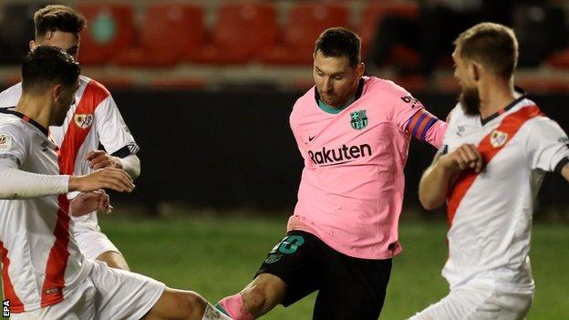 Barcelona skipper Lionel Messi tries to take on the Rayo Vallecano defence in the Copa del Rey tie on Wednesday