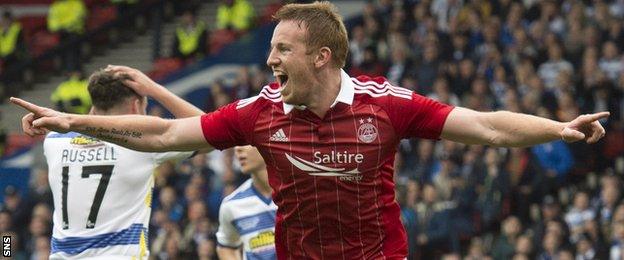 Adam Rooney celebrates scoring Aberdeen's opening goal against Morton