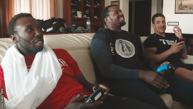 Dillian Whyte playing a computer game with friends