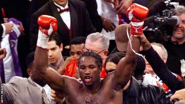 Lennox Lewis celebrates against Evander Holyfield