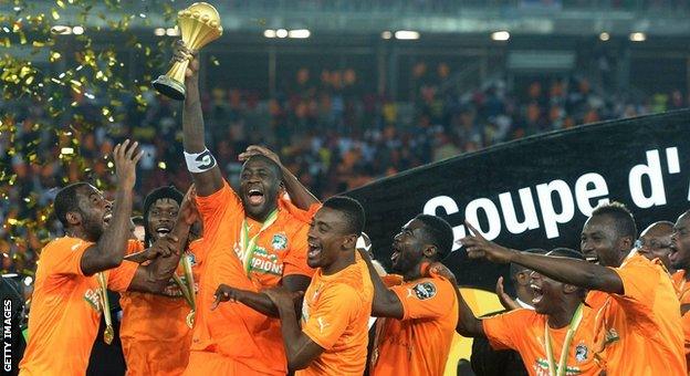 Yaya Toure holds the Africa Cup of Nations trophy aloft in 2015