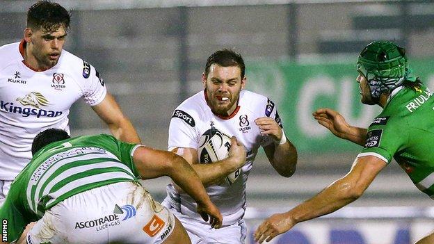 Darren Cave attempts a burst for Ulster in Italy