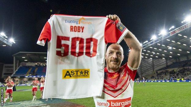 James Roby holds up a shirt saying 'Roby 500' after reaching the milestone for St Helens against Leeds