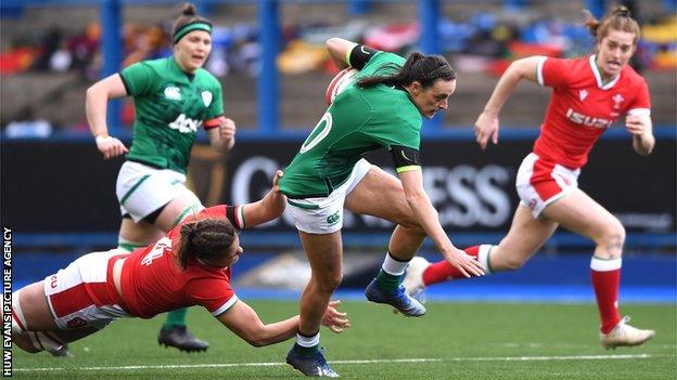 Hannah Tyrrell of Ireland is tackled by Natalia John of Wales