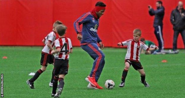 Jeremain Lens (centre) trains with under-eights