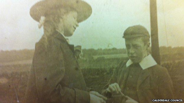 Young boy and girl in period clothing