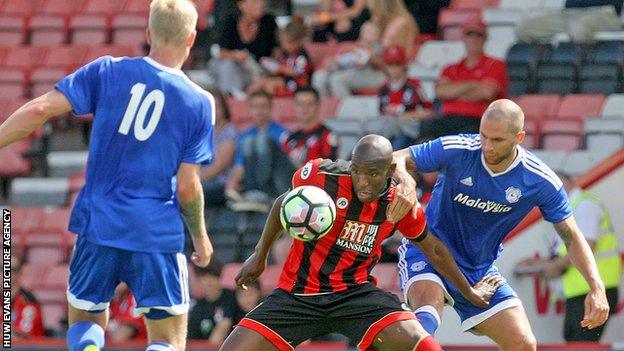 Benik Afobe is challenged by Matt Connolly