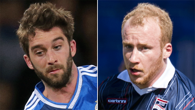 Wigan's Will Grigg and Liam Boyce of Ross County