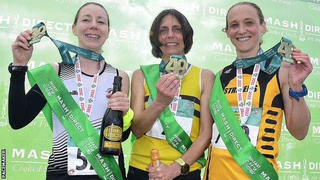 Women's winner Gladys Ganiel (centre) with other podium finishers Gillian McCrory (left) and Natalie Hall (right)