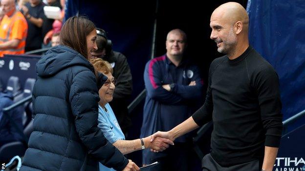 Olga Halon, second left, meets Pep Guardiola before the match