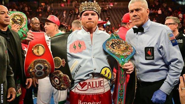 Canelo Alvarez with his belts