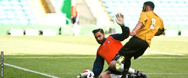 More action from the UK Asian Football Championship final at Celtic Park