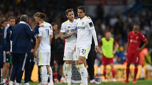 Pascal Struijk looking distraught after his red card against Liverpool