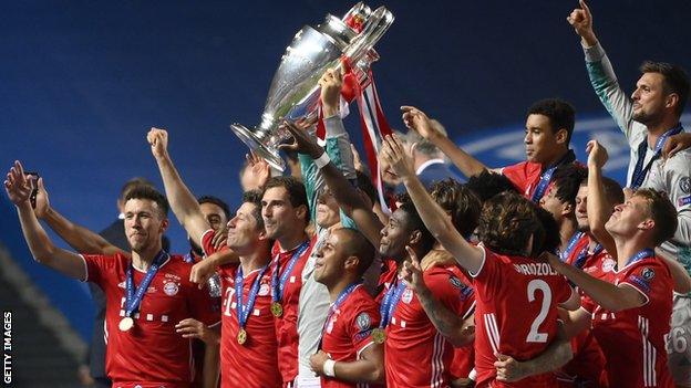 Bayern Munich players celebrate with the Champions League trophy