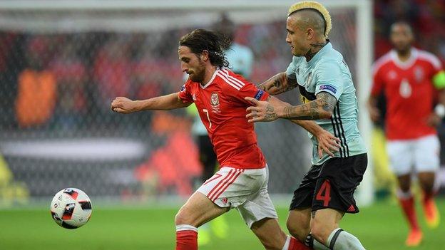 Joe Allen battles for the ball with Belgium's Radja Nainggolan