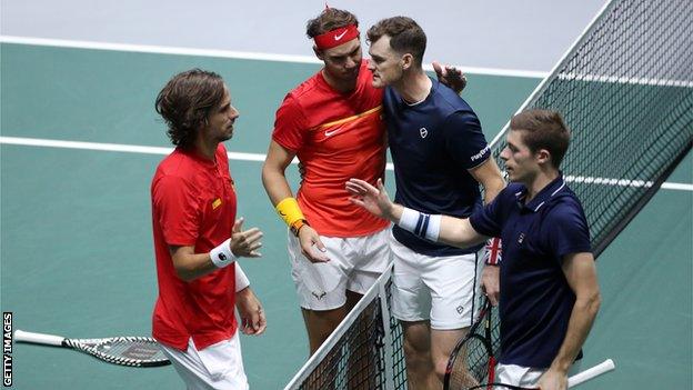 Feliciano Lopez, left, and Rafael Nadal console Jamie Murray and Neal Skupski, right, after the pair lost both sets on tie-breaks