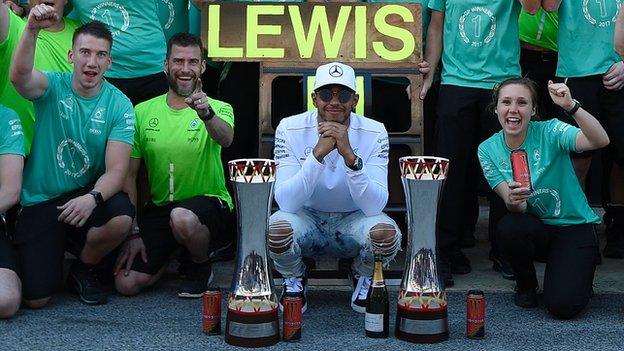 Lewis Hamilton celebrates with his team after winning the Spanish GP