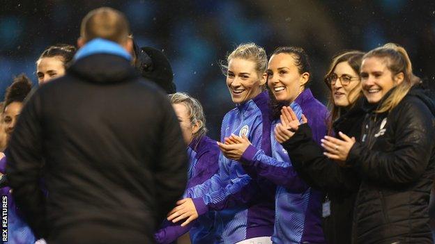 Manchester City's players form a guard of honour for Cushing after the game