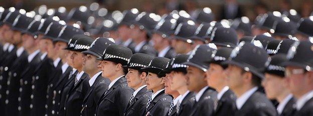 Newly qualified Metropolitan police officers take part in their Passing out Parade, at Hendon Police Training College