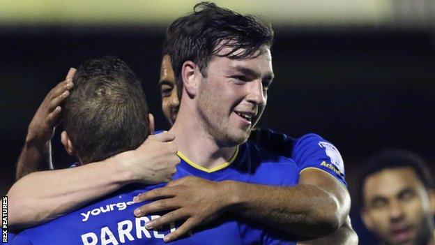 Sean Kelly celebrates scoring for AFC Wimbledon