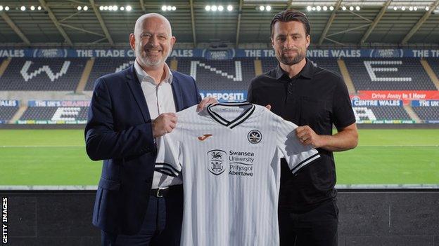 Russell Martin was unveiled alongside Julian Winter after signing a three-year deal at Swansea