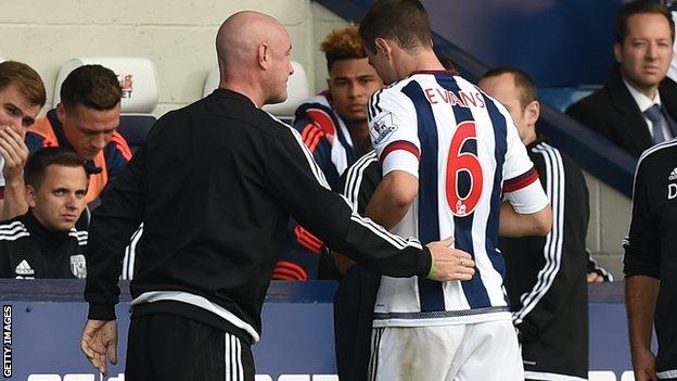 Jonny Evans is led off the pitch