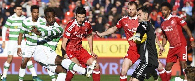 Joe Lewis saves a close-range shot by Celtic's Moussa Dembele