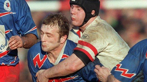 Stade's Richard Dourthe feels the force of a Tony McWhirter during the famous semi-final win at Ravenhill