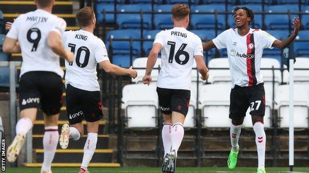 Dylan Kadji celebrates his goal with Bristol City team-mates