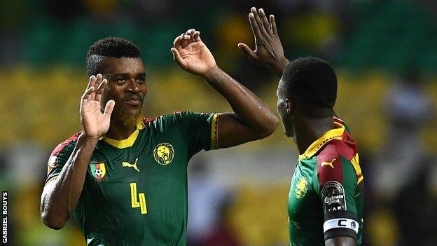 Adolphe Teikeu (left) and Benjamin Moukandjo celebrate after Cameroon reach last eight