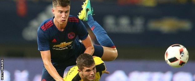 Paddy McNair (left) in action during pre-season for Manchester United