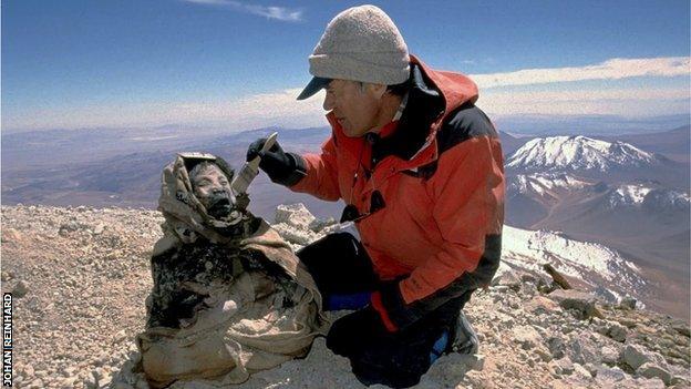 Johan Reinhard excavating the mummies