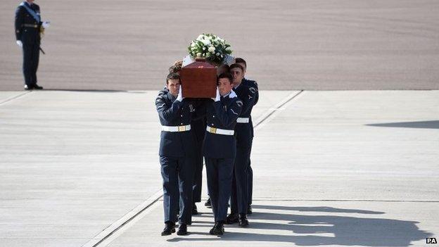 Coffin of Claire Windass is carried from the RAF C-17 at RAF Brize Norton in Oxfordshire