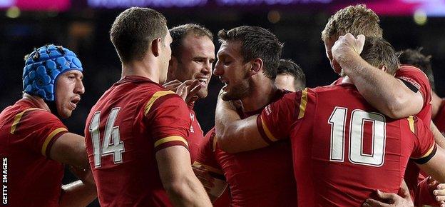 Captain Sam Warburton congratulates his players after Wales beat England