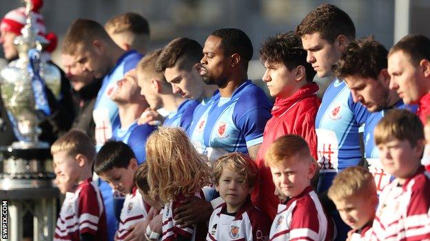 Red Star Belgrade players line up before Challenge Cup debut