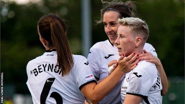 Stacey John-Davis celebrates with Swansea team mates after scoring