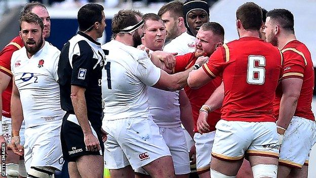 England's Joe Marler (2-L) scuffles with Wales' Samson Lee