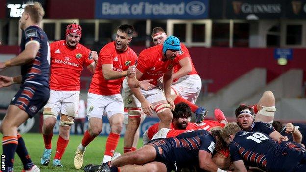 Munster players celebrate CJ Stander's late try against Edinburgh