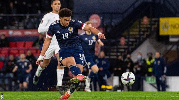 Scotland's Che Adams scores