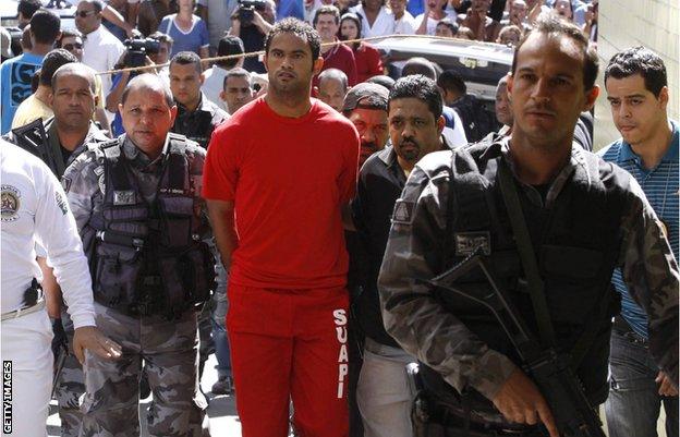 Bruno, being taken into police custody in July 2010