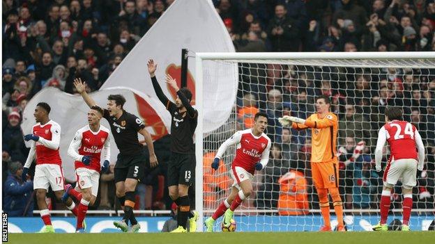 Alexis Sanchez (centre) turns away to celebrate scoring for Arsenal against Hull