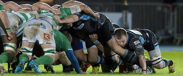 Glasgow Warriors players in a scrum