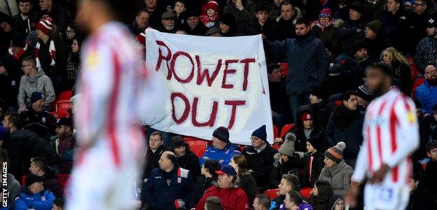 Stoke fans display a 'Rowett Out' banner at their game against Bristol City