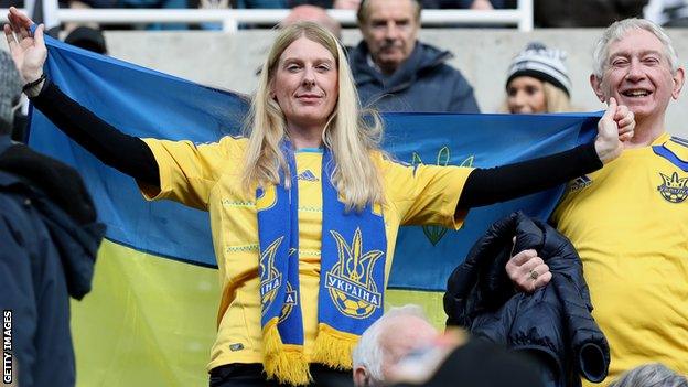 These Newcastle supporters donned Ukraine shirts, scarves and a flag to demonstrate their support